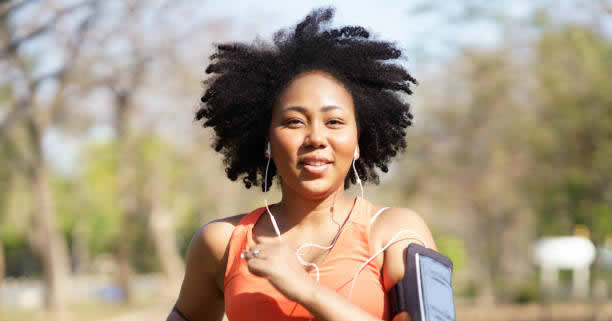 Woman with earphones outdoors